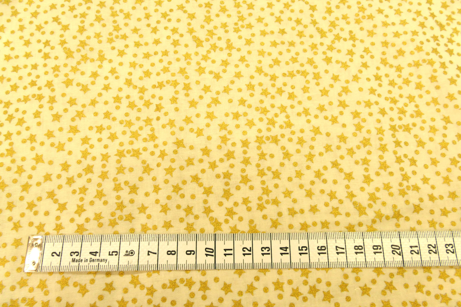 Baumwolle Sterne gold klein creme
